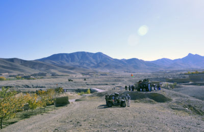 Boys and young men gather around Afghan National Army special forces to receive candy, art and school supplies, and hand-crank radios during a presence patrol, Sayed Abad district, Nov. 6. The ANASF and coalition special operations forces visited three villages in the area to distribute items and ask about the living conditions and needs of the villagers.