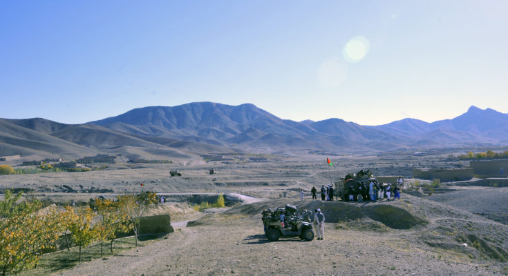 Boys and young men gather around Afghan National Army special forces to receive candy, art and school supplies, and hand-crank radios during a presence patrol, Sayed Abad district, Nov. 6. The ANASF and coalition special operations forces visited three villages in the area to distribute items and ask about the living conditions and needs of the villagers.